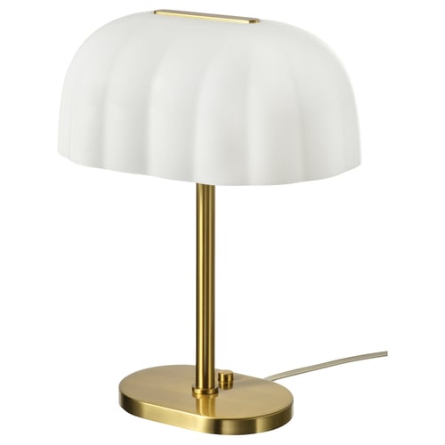 AKTERSPRING laualamp, valge ja kuldne. Klanitud, ovaalne alus, pehme klaasist vari. Elegantne ja lihtne disain igasse keskkonda.