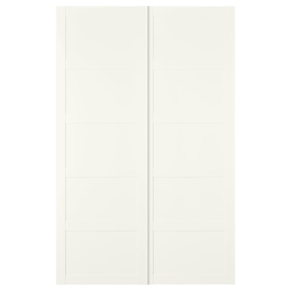 Moodsa ruudukujulise disainiga valge BERGSBO lükanduks. See on valmistatud puitkiudplaadist ja sellel on klanitud ja minimalistlik välimus.