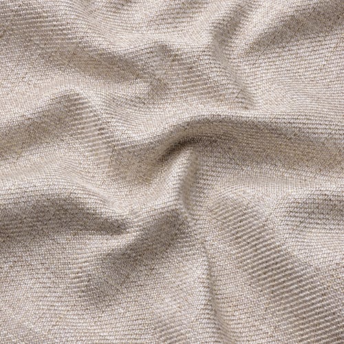 Lähivõte luksuslikust, pehmest, tekstuursest melanži efektiga beežist kangast.