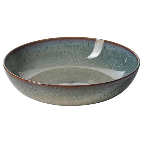 Rohekassinise värvi GLADELIG kauss, millel on vintage-inspireeritud, käsitööna valminud välimus. See on valmistatud reaktiivse glasuuriga kivikeraamikast, mis sobib suurepäraselt toitude serveerimiseks.