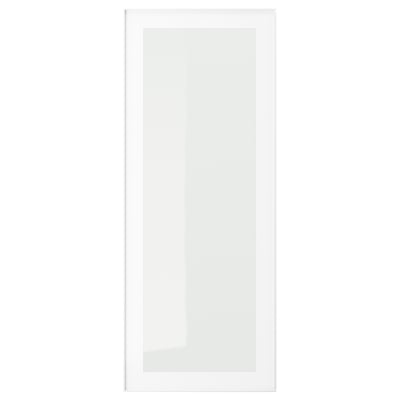 Moodsa minimalistliku disainiga valge HEJSTA klaaskapi uks, millel on integreeritud käepide ja raamitud servad.