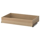 Heledat tammevärvi ikea KOMPLEMENT sahtel. Selle ristkülikukujuline heleda puidusüü tekstuuriga, millel on sujuvaks tööks metallist siinid.