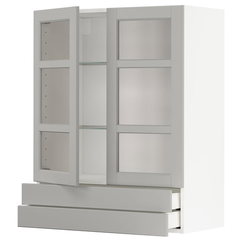 Valge ikea METOD klaasuste ja sahtlitega köögikapp.