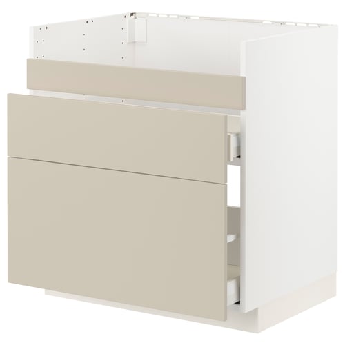 Kaasaegne beež köögikapp siledate esipaneelidega. Puitkiudplaadist ja puitlaastplaadist valmistatud plaat on elegantse ja minimalistliku disainiga.