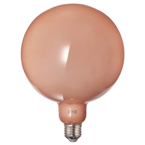 IKEA virsikuvärvi klaasiga ümar lambipirn, millel on soe sära ja elegantne lihtsus.