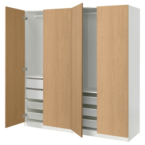 PAX garderoob: puidust uksed, valge sisemus, riiulid ja sahtlid, pehmelt sulguvad hinged.