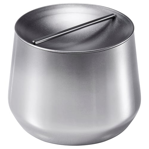 Round, silver metal container with lid and ventilation slot for kitchen storage.