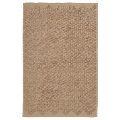 Beige FJÄLLKATTFOT bath mat, cotton, rectangular, textured.
