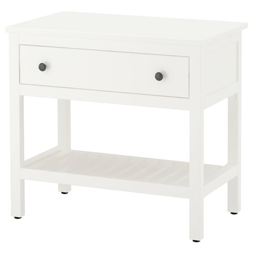 A white wooden HEMNES bedside table with a single drawer and an open shelf, featuring stylish round knobs.