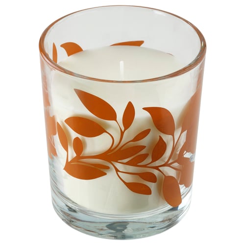 HÖSTAGILLE glass candle, white with orange leaf design, cylindrical shape with tealight holder use.