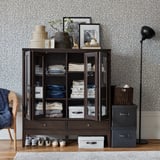 IDANÄS Cabinet with bi-folded glass doors, dark brown stained, 121x50x135 cm