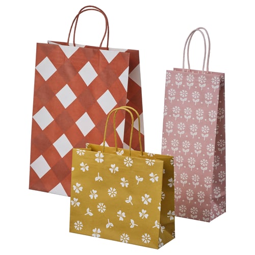 Three colourful gift bags in orange and yellow with floral patterns and handles. Perfect for gifting bottles or jars.