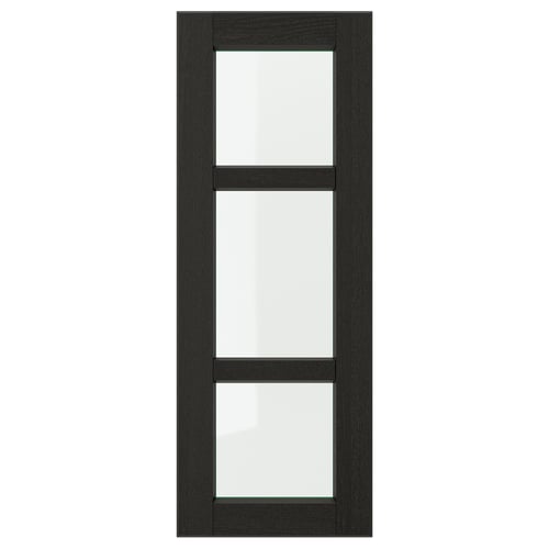 A LERHYTTAN black wooden kitchen door with bevelled edges and clear glass panels. The door has a classic, traditional design.