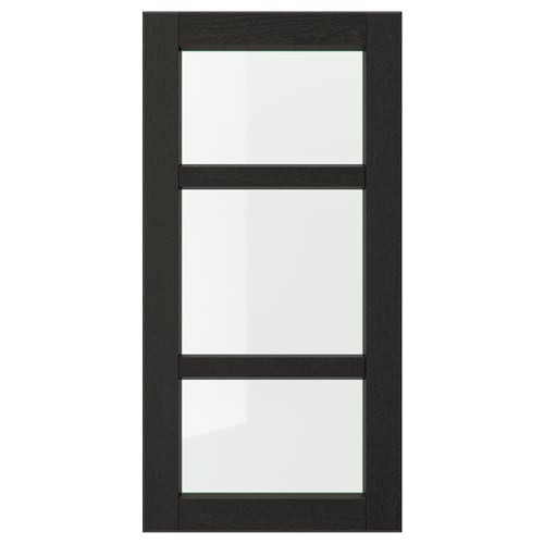 A black LERHYTTAN kitchen cabinet door with a solid wood frame and clear glass panels, showcasing a traditional design.