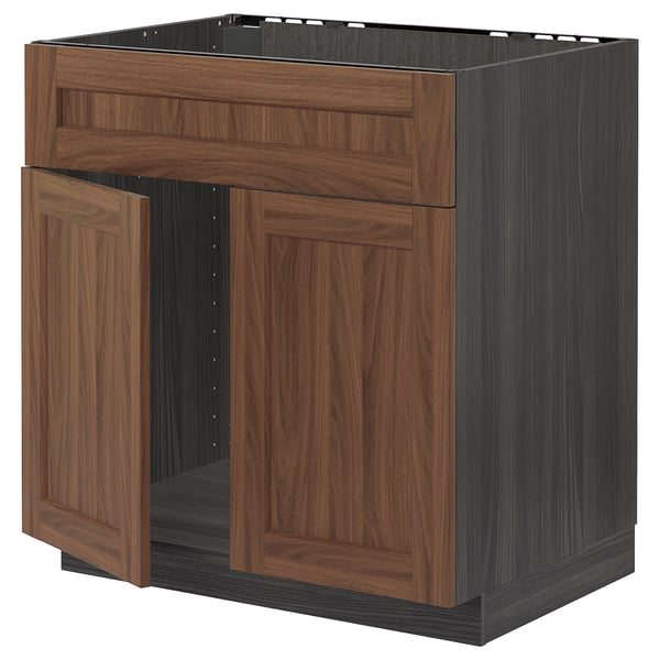 A dark brown wooden kitchen cabinet, part of the METOD series, complete with wooden doors and drawer fronts.