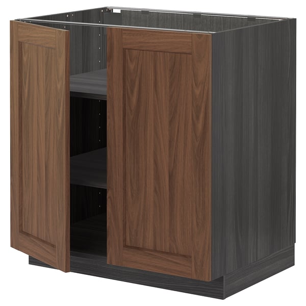 Brown wooden cabinet with two openable doors made from METOD kitchen system.