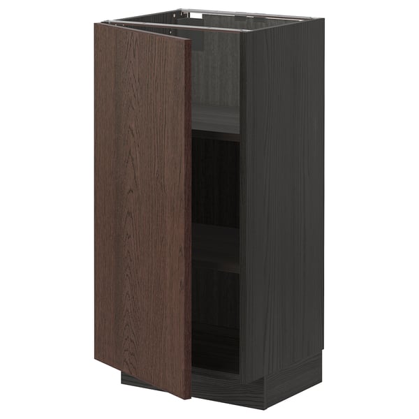 Dark brown wooden cabinet with one open door, showing adjustable shelves inside. Simple, rectangular design with metal hinges.