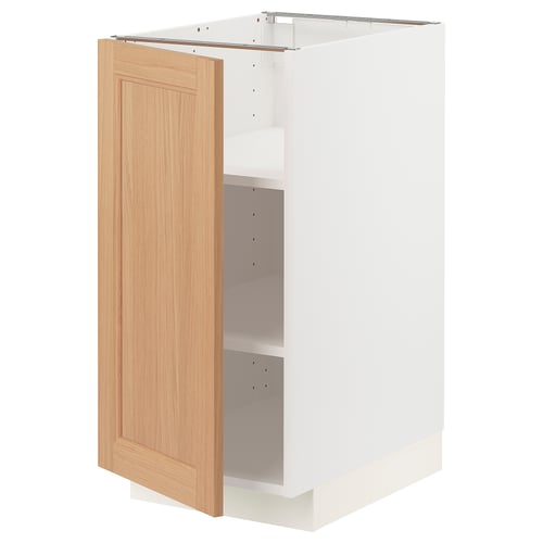 An open white METOD kitchen cabinet with a wooden door. The door is light brown with a smooth finish.