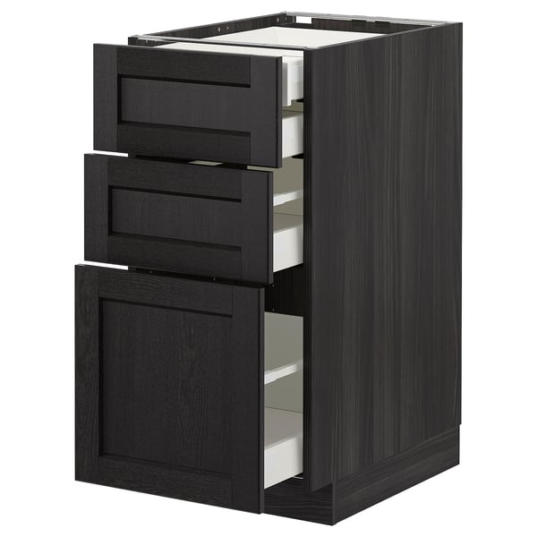 Black METOD kitchen cabinet with three drawers, two partially open.
