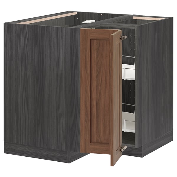A black ikea METOD kitchen unit with a walnut finish. It a door and a carousel shelf for storing items.