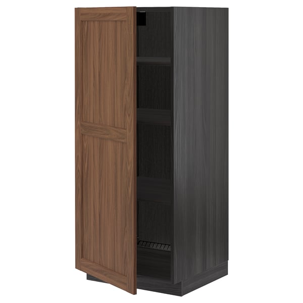 Ikea METOD kitchen cabinet with walnut door opened.