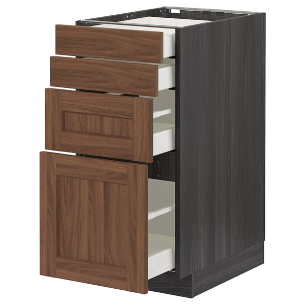 METOD kitchen unit with walnut drawers & dark base, three drawers pulled out.