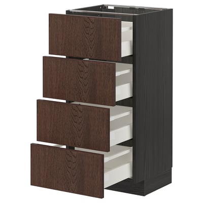 Dark brown wooden drawers pulled out on a tall black cabinet.