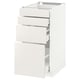 A white METOD kitchen cabinet with three drawers and an open compartment. Its modern, rectangular, and smooth lines.