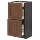 Dark wood METOD kitchen cabinet with steel drawers opens showing organised storage.