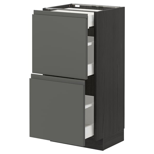 Modern dark grey kitchen unit, two open drawers.