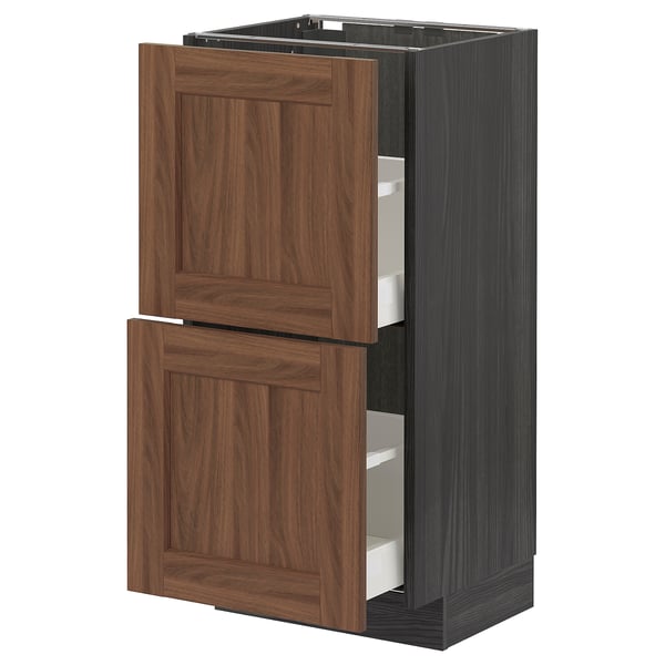 An open brown METOD kitchen cabinet with two drawers. This modern design wooden-style fronts and metal drawer runners.