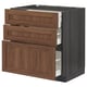 Wood-colored kitchen cabinet set with three drawers and a pullout shelf.