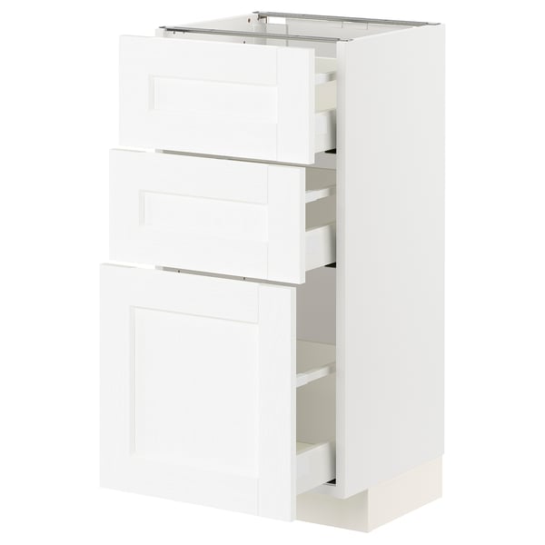 White METOD kitchen cabinet with multiple drawers, sleek and modern design.
