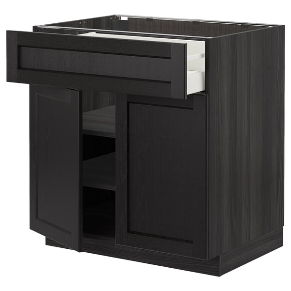 Black METOD kitchen cabinet with drawers and shelves. Dark wood finish, modern design. Adjustable shelves and smooth drawer.