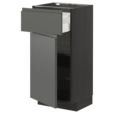 Depicts a black-brown kitchen cabinet unit with a dark grey drawer and door, featuring a sleek, modern design.
