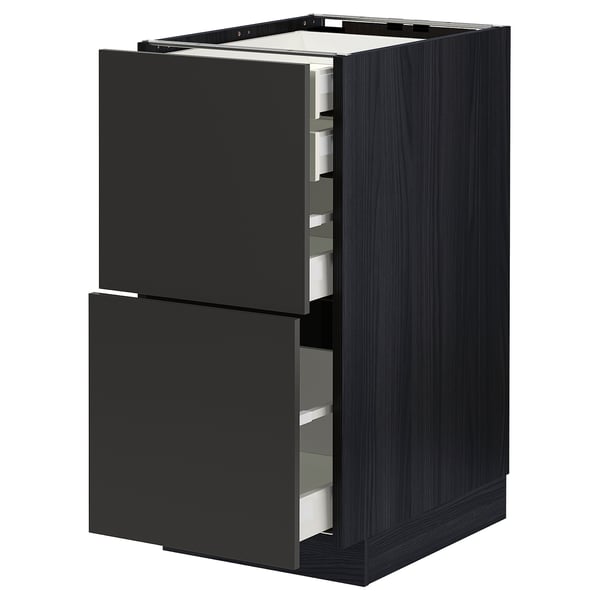 Modern black kitchen cabinet with two open drawers, sleek design, dark wood texture.