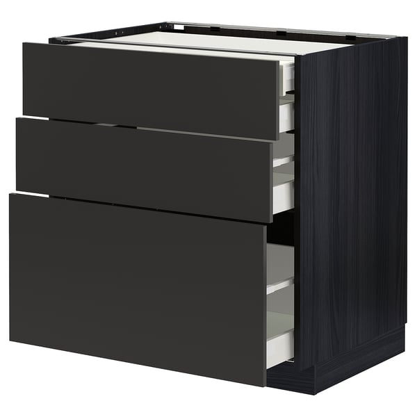 This image shows a modern black METOD kitchen cabinet with three open drawers revealing organised interiors.