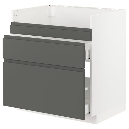 A modern kitchen cabinet in white with dark grey drawers, featuring a sleek and minimalist design.