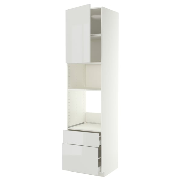 A white METOD kitchen unit with glossy drawers and open storage.