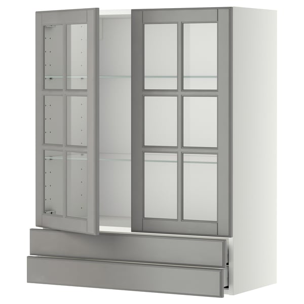 White and grey kitchen cabinet with glass doors.