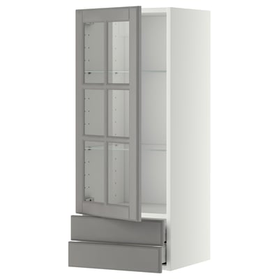Modern white cabinet, grey-tinted glass doors, sleek handles, tall & rectangular, adjustable shelves.