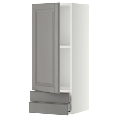 Modern kitchen cabinet in grey with bevelled edges, featuring an open door, adjustable shelf, and pull-out drawer.