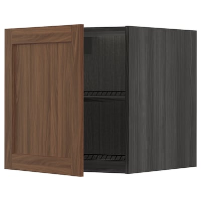 An open walnut-brown wooden cabinet with a black interior and adjustable shelves.