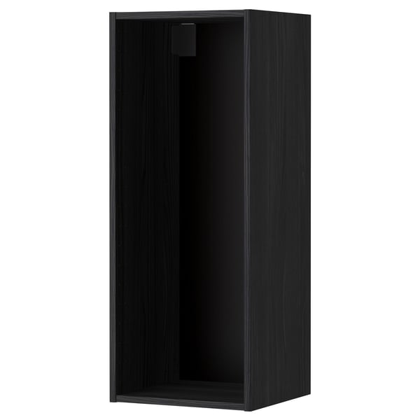 A black ikea METOD wall cabinet. Its rectangular, a simple design, and has a sturdy construction.