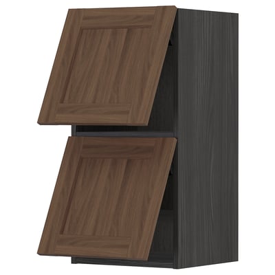 Walnut METOD kitchen cabinet with dark frame, rectangular shape, and wooden texture doors.