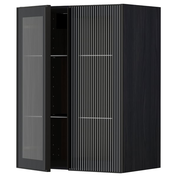 Modern black METOD kitchen cabinet with reeded glass doors and sleek metal frame.