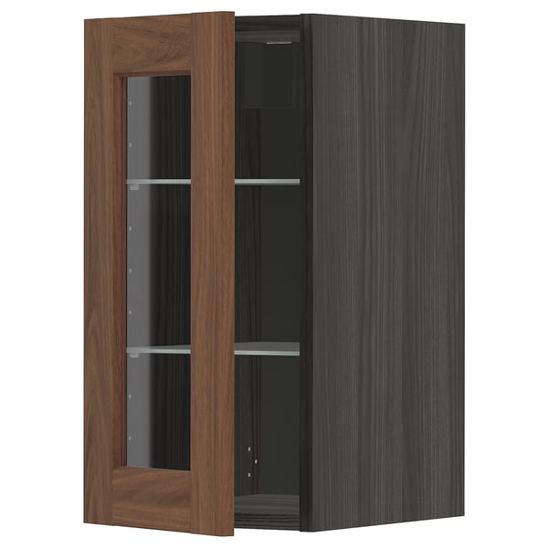 Wooden and glass kitchen cabinet with open door, dark finish.