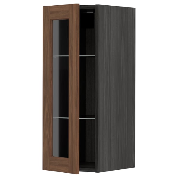 METOD kitchen cabinet with walnut-colored glass doors, sleek design, sturdy frame.