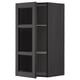 Black stained wooden kitchen cabinet with glass doors and shelves.