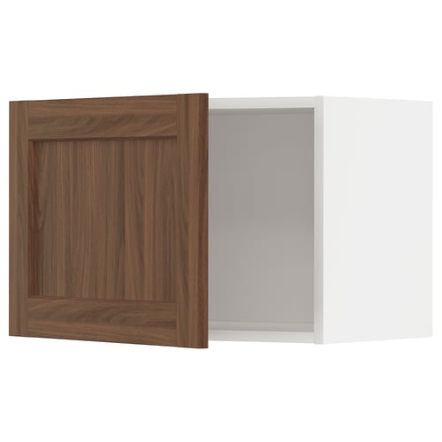 Ikea METOD kitchen cabinet in walnut wood color with white interior.